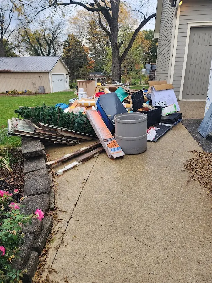 Dumpster being loaded with debris for 30 Yard Dumpster Rental in Upper Deerfield